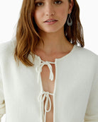 Close-up of tubular hem neckline and fine knitted cuffs