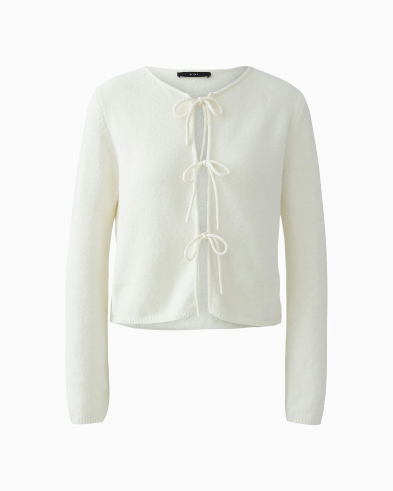 Front view of narrow cut short cardigan with round neck