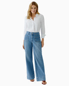 Woman wearing Oui wide-leg blue jeans, full outfit model view – Áines Boutique