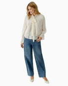 Oui knit vest styled over blouse for smart layering look