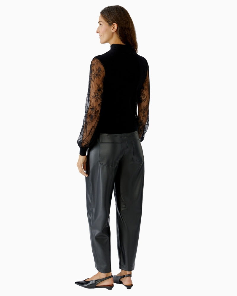 Back view of black knit pullover with lace detail