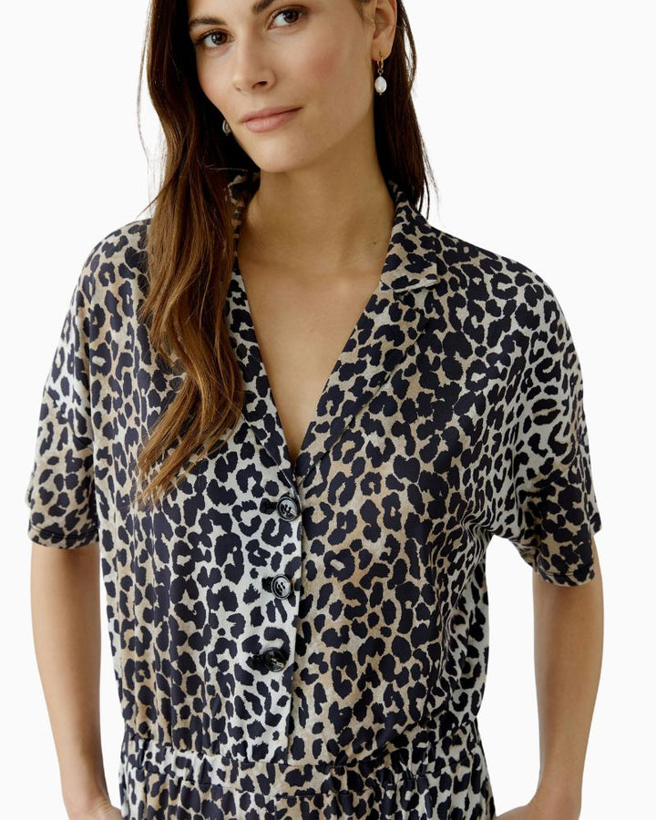 Close-up of silky fabric texture and button placket