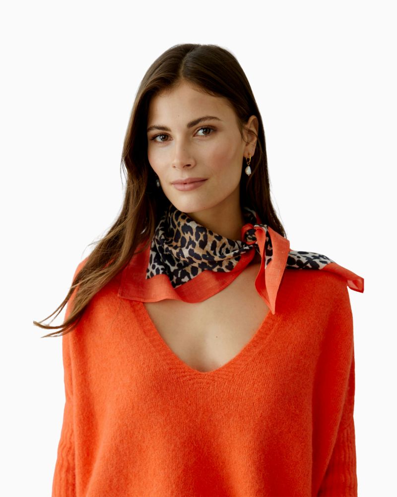 Close-up of Oui square shawl showing all-over leopard pattern and hemmed edge