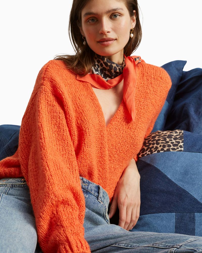 Close-up of Oui square shawl showing all-over leopard pattern and hemmed edge