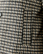 Close-up of lapel collar and textured cotton-blend fabric with a hint of lustre in light stone tone