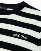 Close-up of Oui T-shirt logo embroidery and cotton texture – Áines Boutique