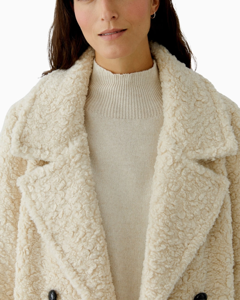 Close-up of smooth polyester fabric and tailored collar