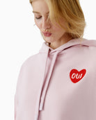 Close-up of heart logo detail on Oui hoodie in soft mauve shade