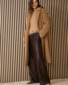 Oui pleat-front dark brown trousers styled with shirt and loafers