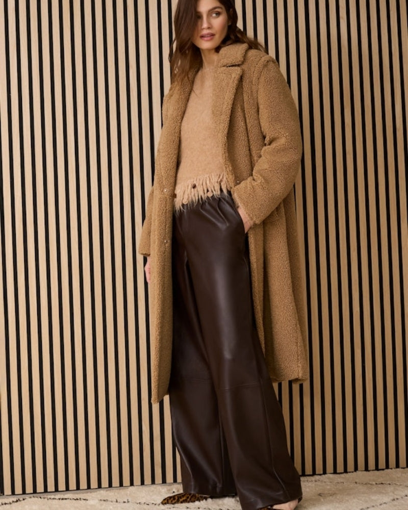 Oui pleat-front dark brown trousers styled with shirt and loafers