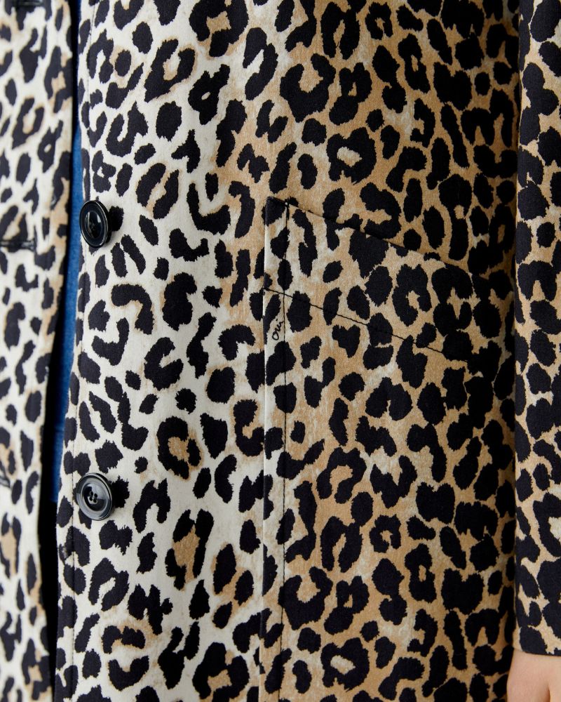 Close-up of button placket and tonal beige lining inside