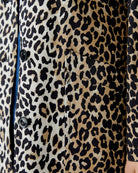 Close-up of button placket and tonal beige lining inside
