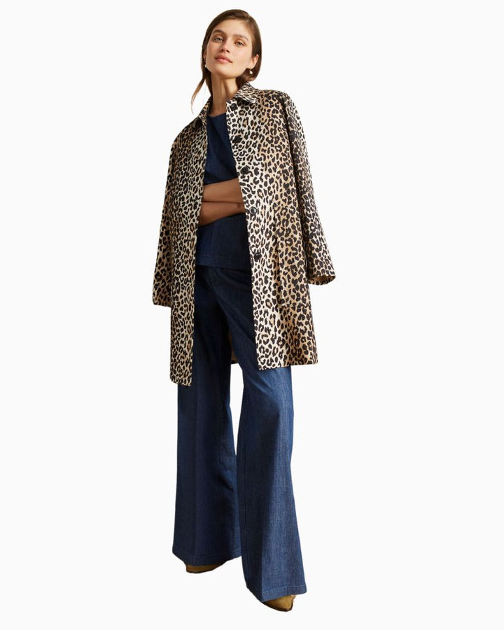 Model wearing printed Oui coat styled with black trousers and heels