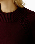 Close-up of rolled hem and soft cotton blend knit in bramble berry