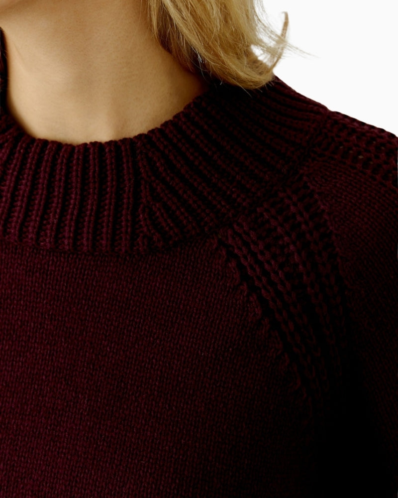 Close-up of rolled hem and soft cotton blend knit in bramble berry