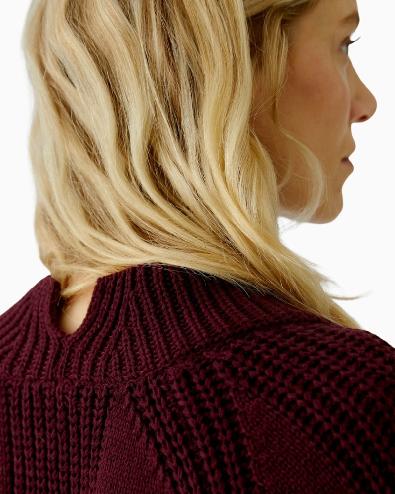 Close-up of rolled hem and soft cotton blend knit in bramble berry