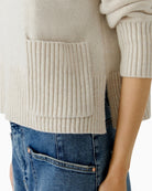 Close-up of side slit hem and ribbed cuff detail on Oui wool blend jumper