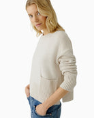 Close-up of side slit hem and ribbed cuff detail on Oui wool blend jumper