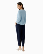 Woman wearing Oui light blue pullover, back view showing length and drape – Áines Boutique