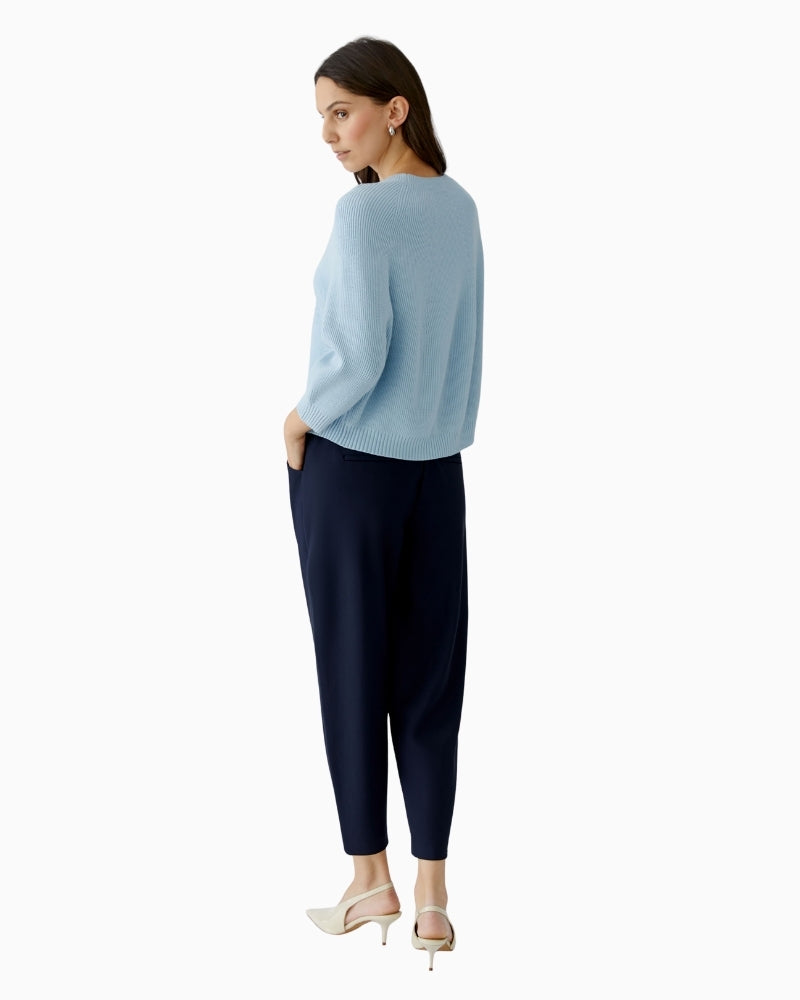Woman wearing Oui light blue pullover, back view showing length and drape – Áines Boutique