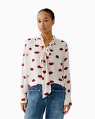 Oui rose red blouse with kissing mouth print and bow-tie neckline