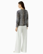 Back view of camel and black animal print blouse by Oui
