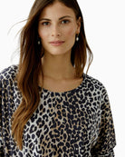 Close-up of silky leopard print fabric in camel and black