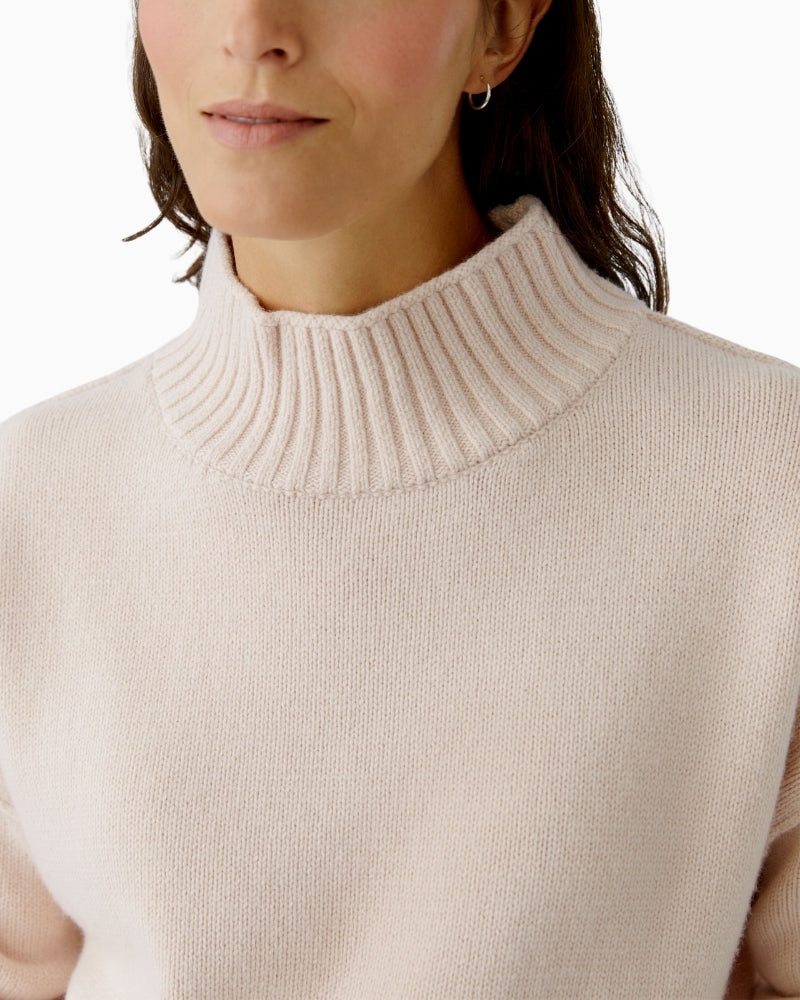 Close-up of wool-cotton blend texture and ribbed collar detail
