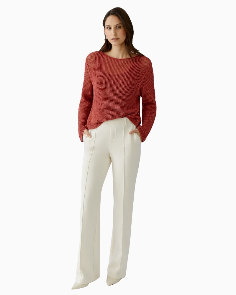Woman wearing Oui cream trousers styled with knit, full outfit view – Áines Boutique