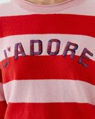 Close-up of round neckline and knit texture in stripe jumper