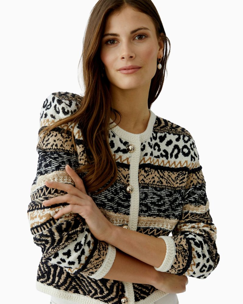 Close-up of half-sphere buttons and raised knit design
