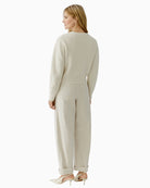 Woman wearing Oui gardenia textured knit pullover back view – Áines Boutique