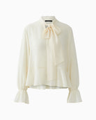 Off-white blouse with tie-knot collar in soft draping fabric