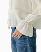 Long-sleeve polyester blouse with buttoned cuffs and relaxed fit