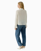 Back view of lightweight off-white blouse showing smooth finish