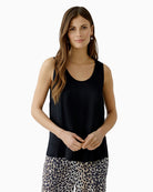 woman wearing Oui A-shape black tank top side view – Áines Boutique