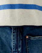 Detail of drawstring hem and cuff contrast in beige/blue finish
