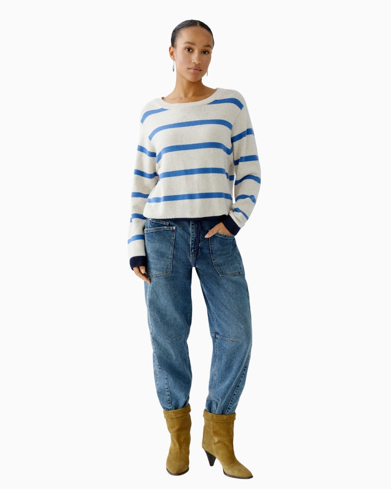 Model wearing Oui Beige/Blue Striped Pullover paired with jeans and boots