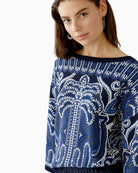 Side view showing contrast ribbed cuffs and relaxed cut