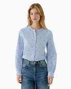 Oui blue cotton blouse with red heart embroidery front view on woman wearing it – Áines Boutique