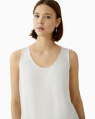 Close-up of neckline with piping detail