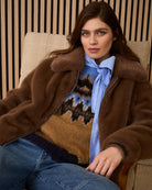 Oui faux fur jacket in taupe paired with jeans