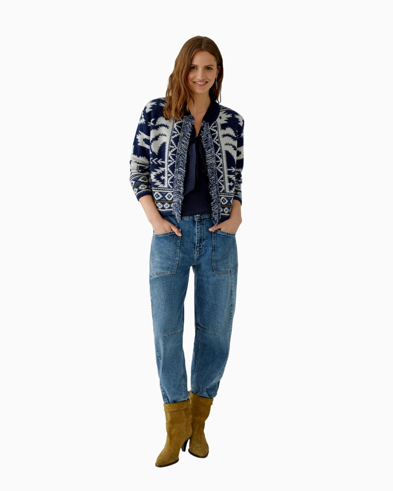 Model wearing cardigan over tee and jeans for casual styling