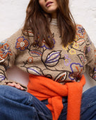Oui Knitted Sweater in Orange styled on waist view