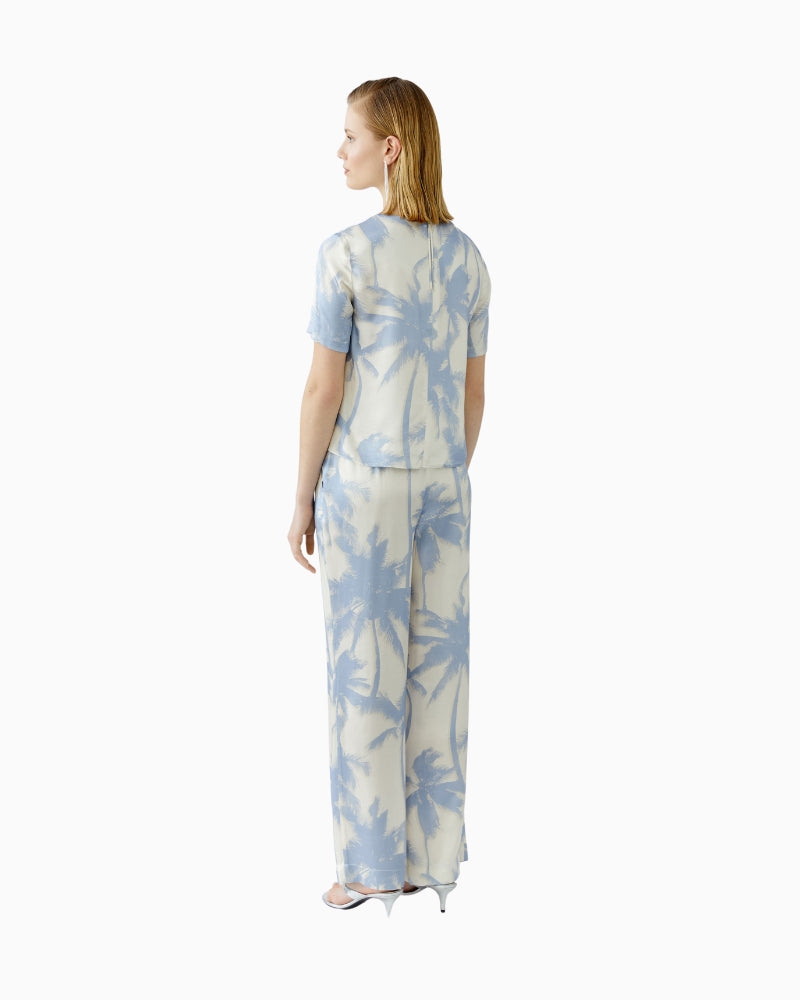 Side view of Oui relaxed fit blouse in soft blue artistic print