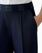 Close-up of elastic waistband with subtle Oui logo print
