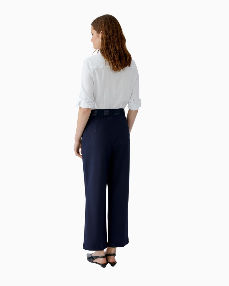 Styled look with cropped trousers and relaxed white top