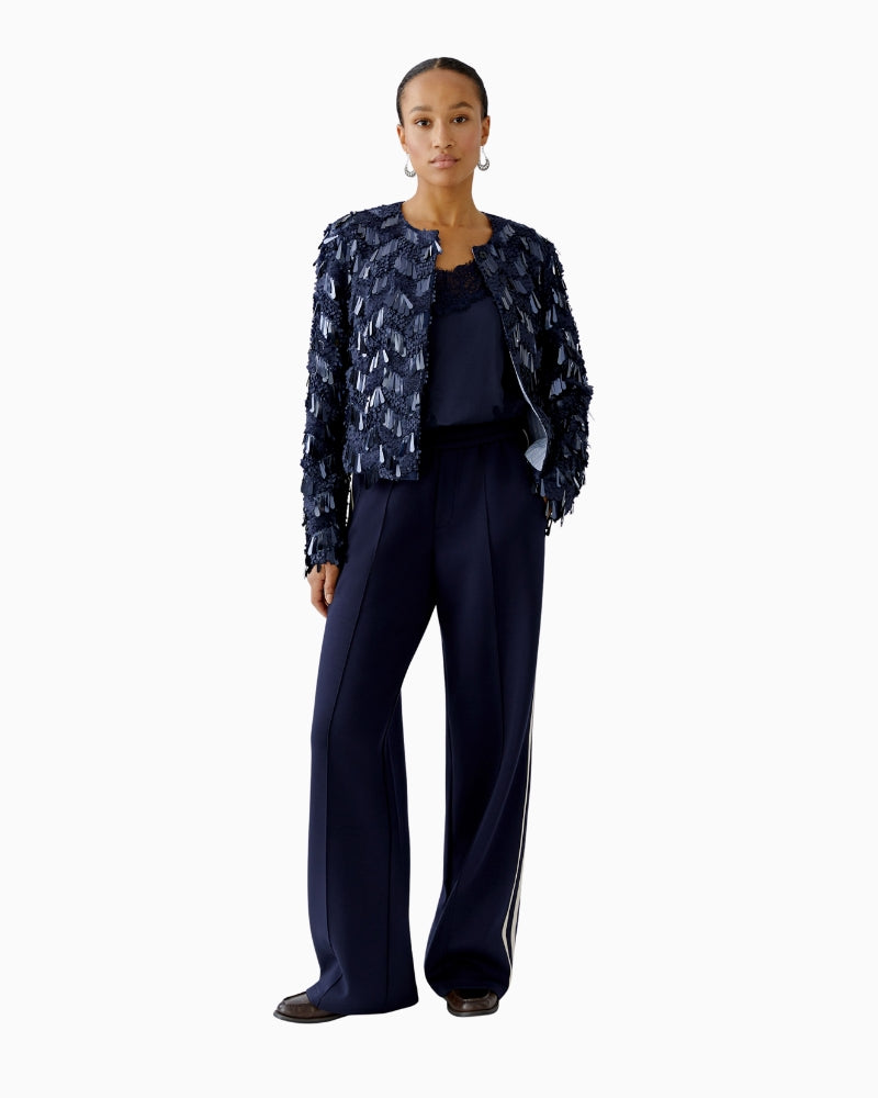 Model wearing jacket with hands in pockets – full look