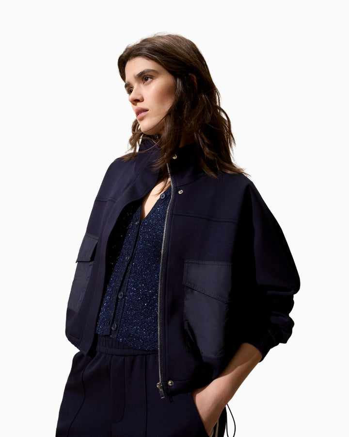 Side view of scuba-style Oui jacket showing relaxed fit