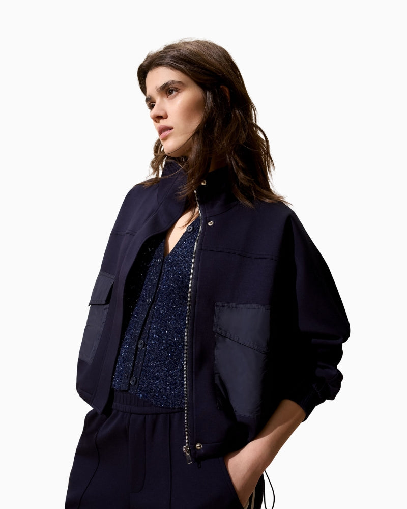 Side view of scuba-style Oui jacket showing relaxed fit
